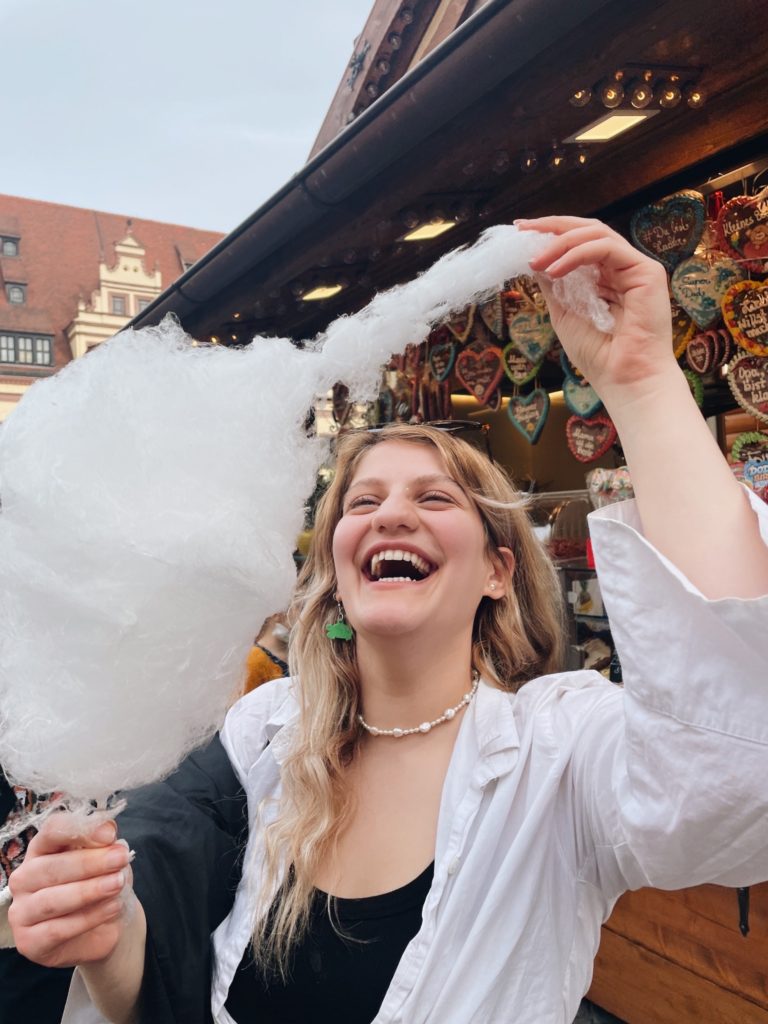 Nora with cotten candy from the German Easter Market. One of the first markings of the end of COVID lockdowns in Leipzig