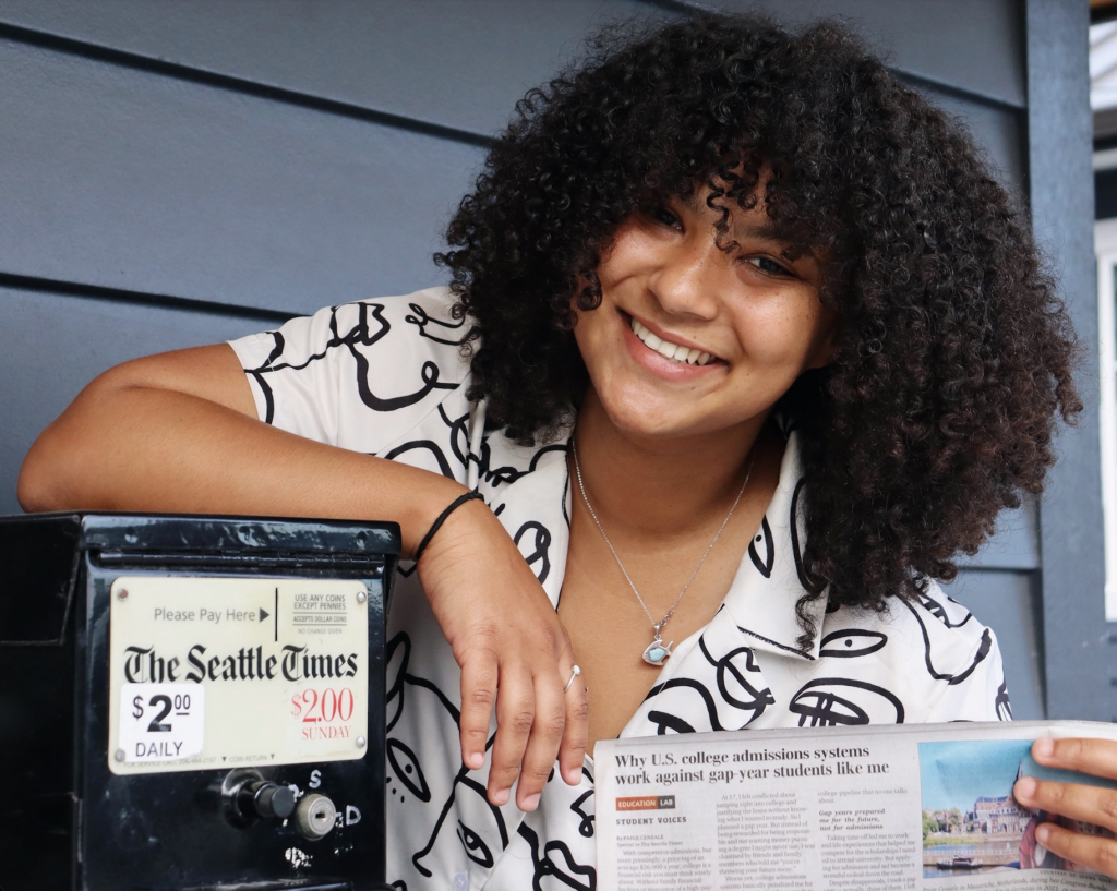 paige censale holding paper with seattle times article